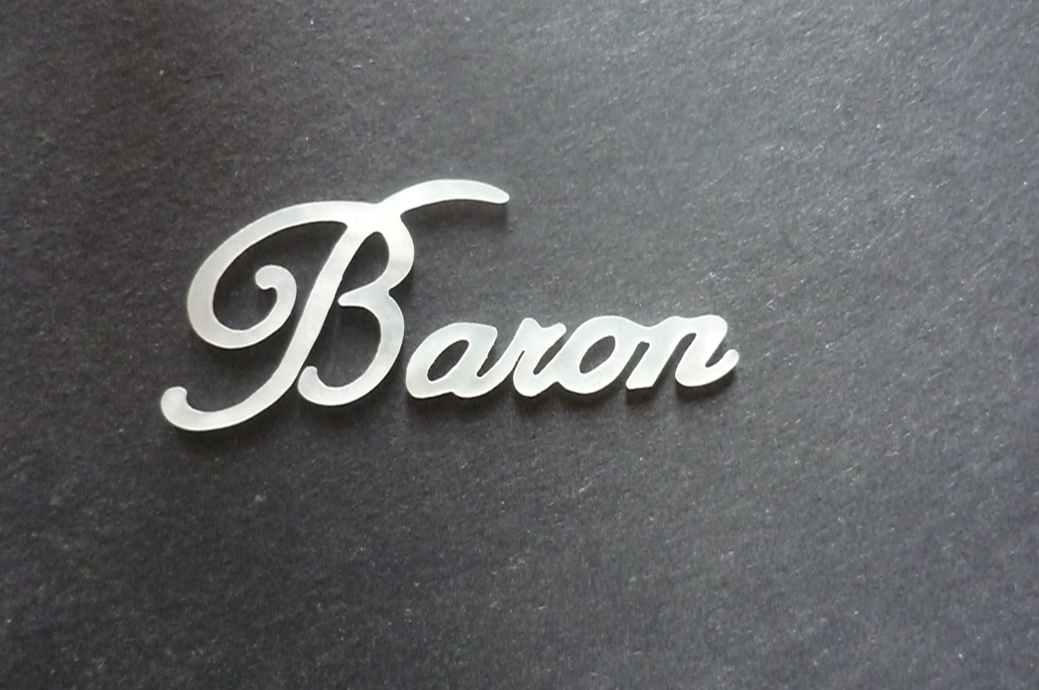 white MOP baron logo